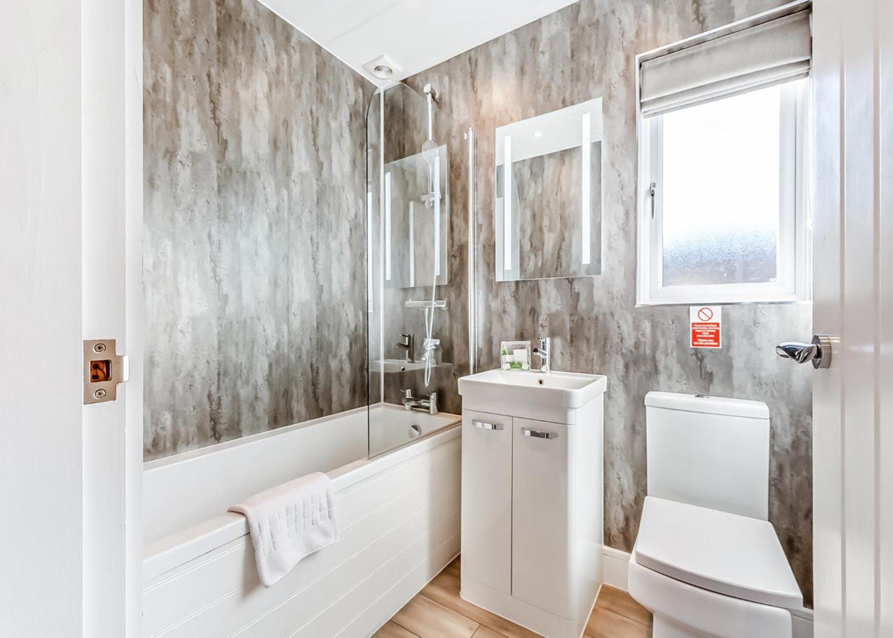 Premium bathroom with freestanding bath and LED mirror