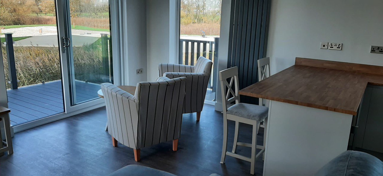 Patio doors opening straight to lakeside decking