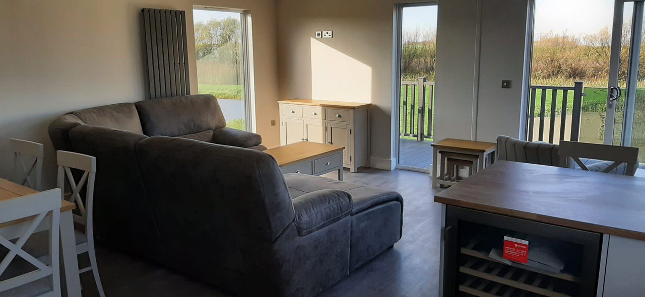 Kitchen island with wine rack and afternoon lake view